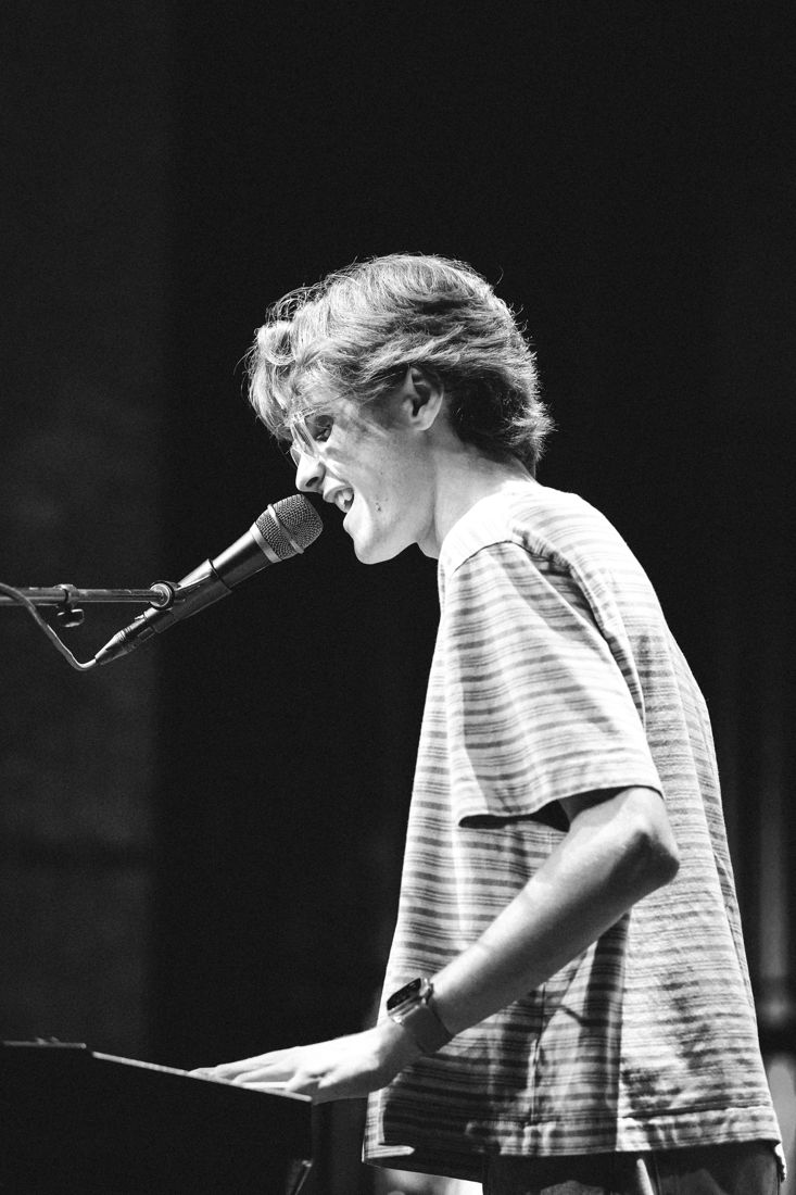 Black and white photo of Joey singing at the keys