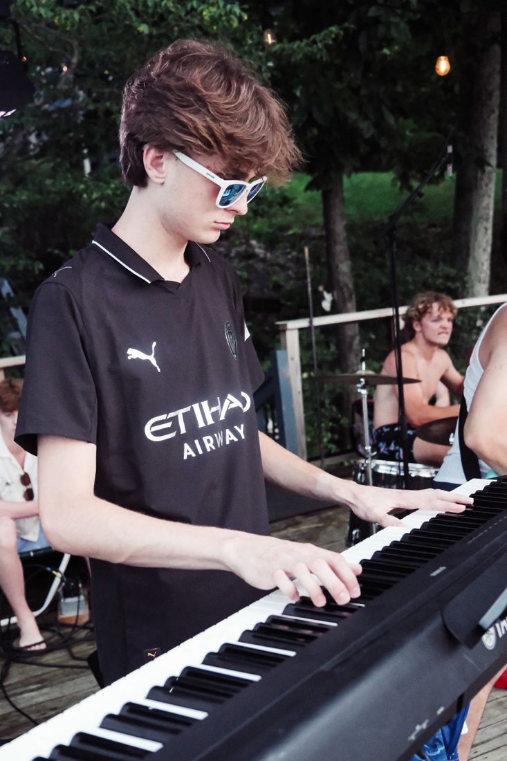 Joey playing keys at an outdoor gig