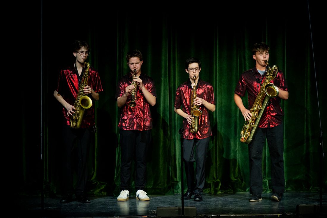 Joey playing alto sax in a saxophone quartet
